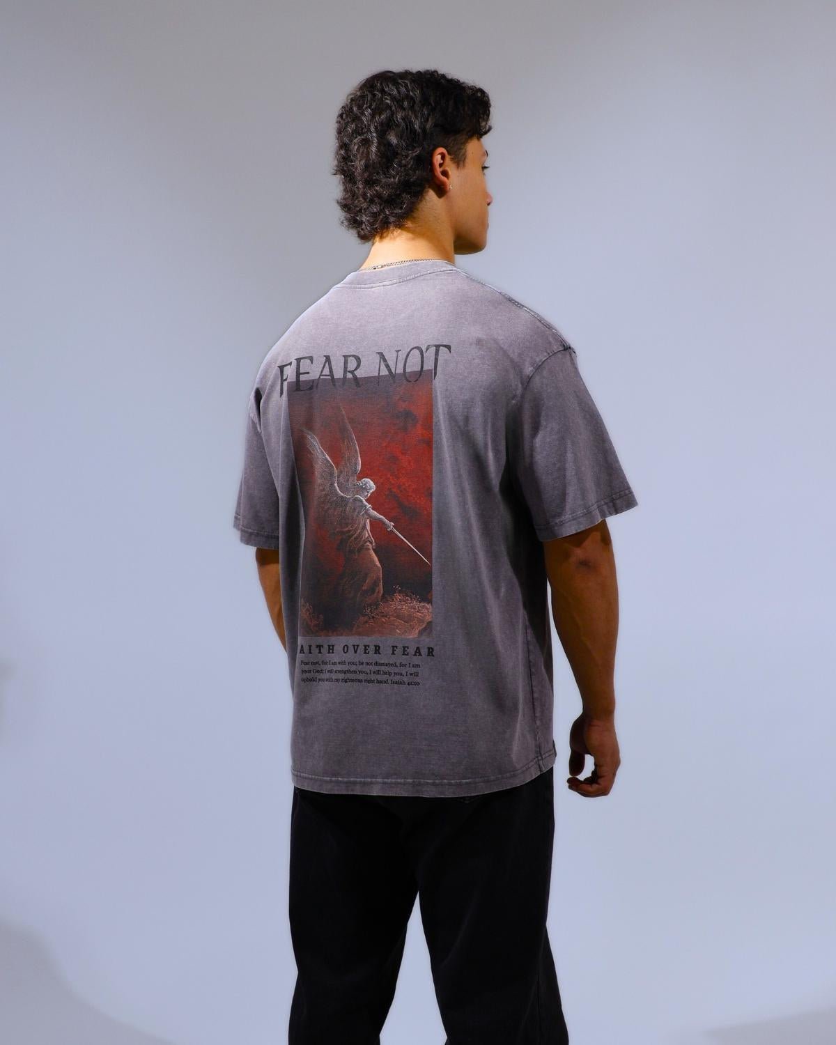 black Faith Over Fear shirt back graphic angled view on model