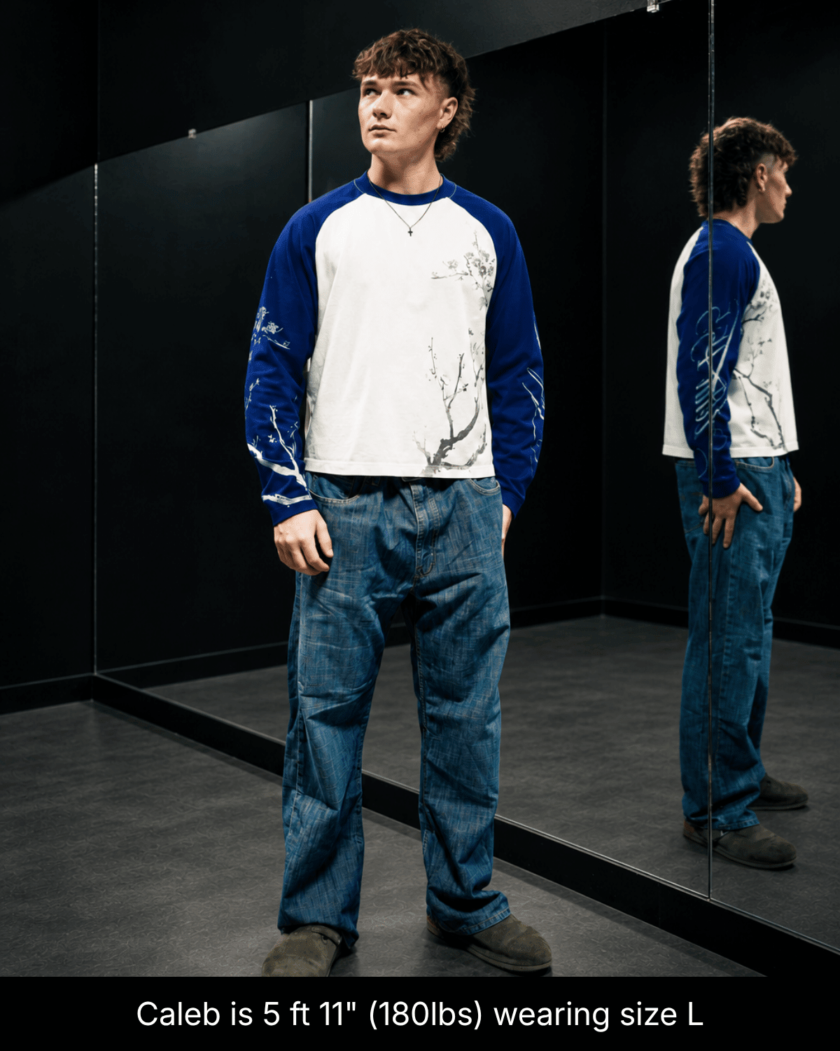 Full-length view of a model wearing the blue and white John 15:5 long sleeve shirt in size L beside a mirror.
