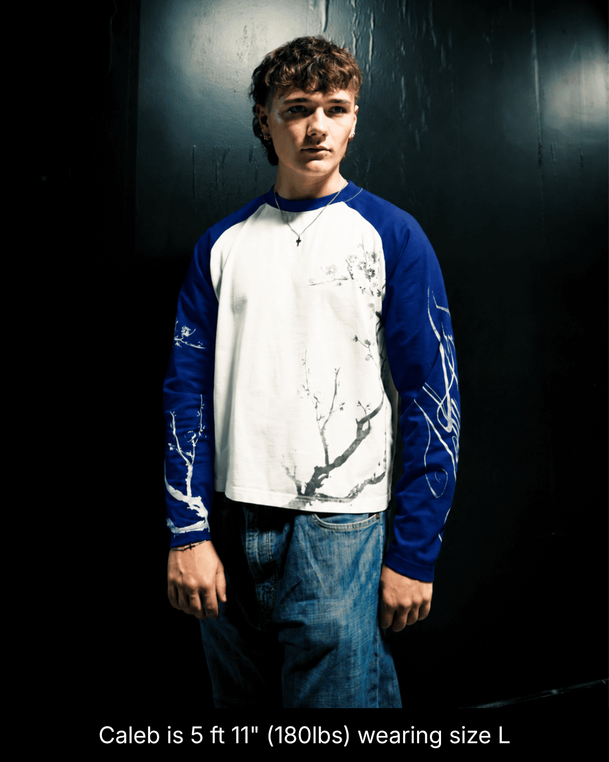 Model wearing the blue and white John 15:5 long sleeve shirt in size L, front view.