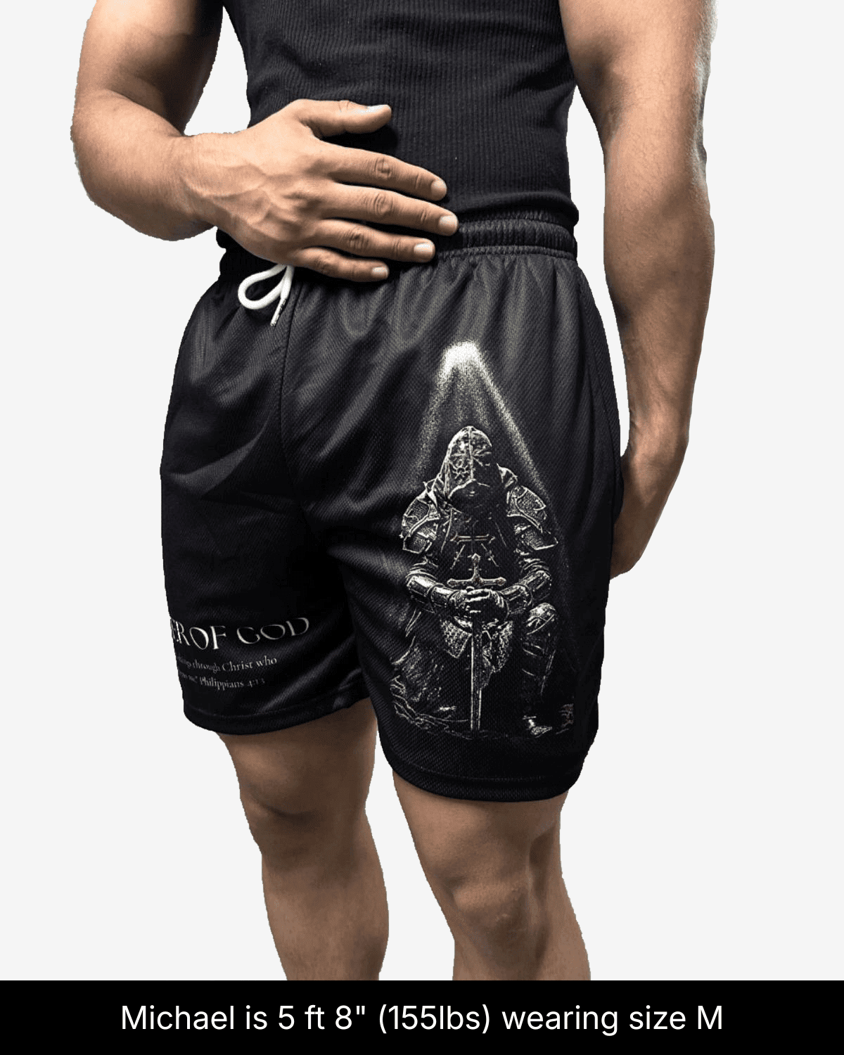 Model wearing black Soldier of God shorts in size M, showing a kneeling armored knight graphic.